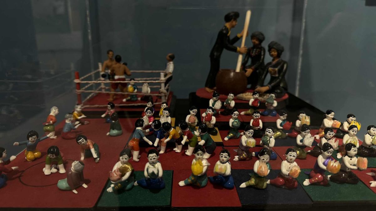Diorama depicting a Muay Thai boxing match and a traditional Thai drum performance at Bang Sai Arts.
