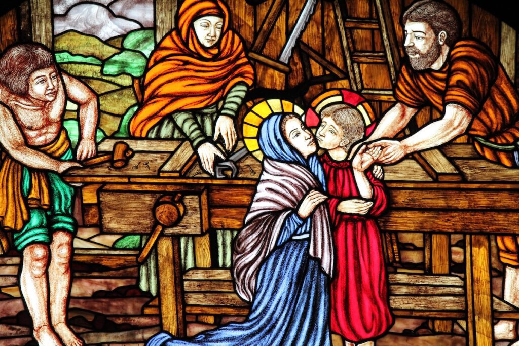 Stained-glass window at Santa Cruz Church, Kudeejeen, showing the Holy Family in a carpenter’s workshop in Nazareth.
