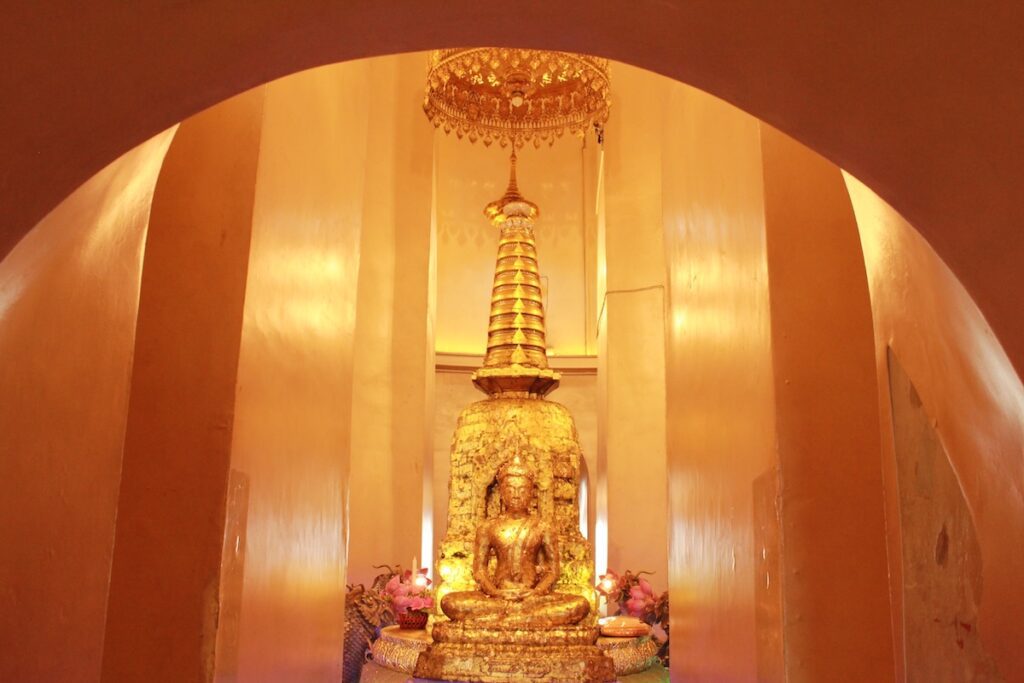 Golden Buddha statue and chedi (stupa) inside Wat Saket Ratcha Wora Maha Wihan, Temple of the Golden Mount, Bangkok, Thailand.