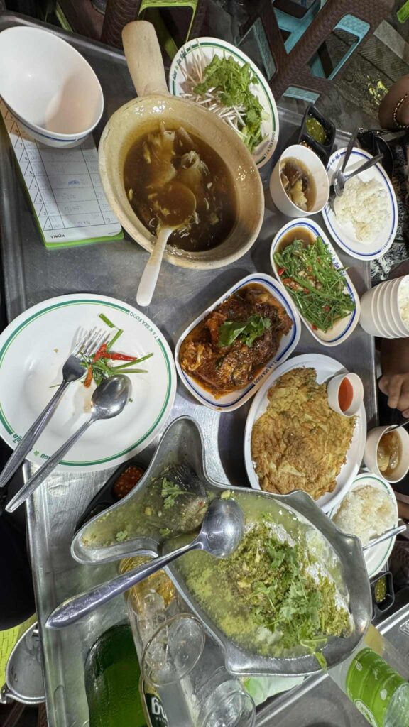 A table full of Thai seafood dishes – A communal meal at a seafood restaurant.