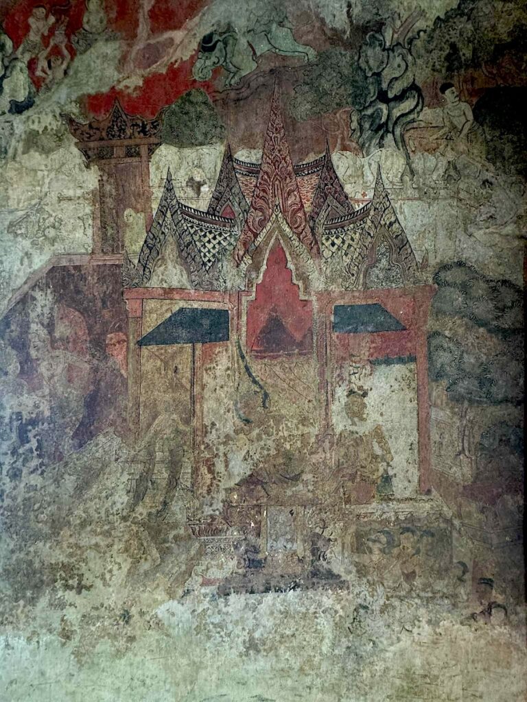 Mural at Wat Phutthaisawan, an ancient temple in Ayutthaya, Thailand, showcasing scenes from Buddhist teachings.
